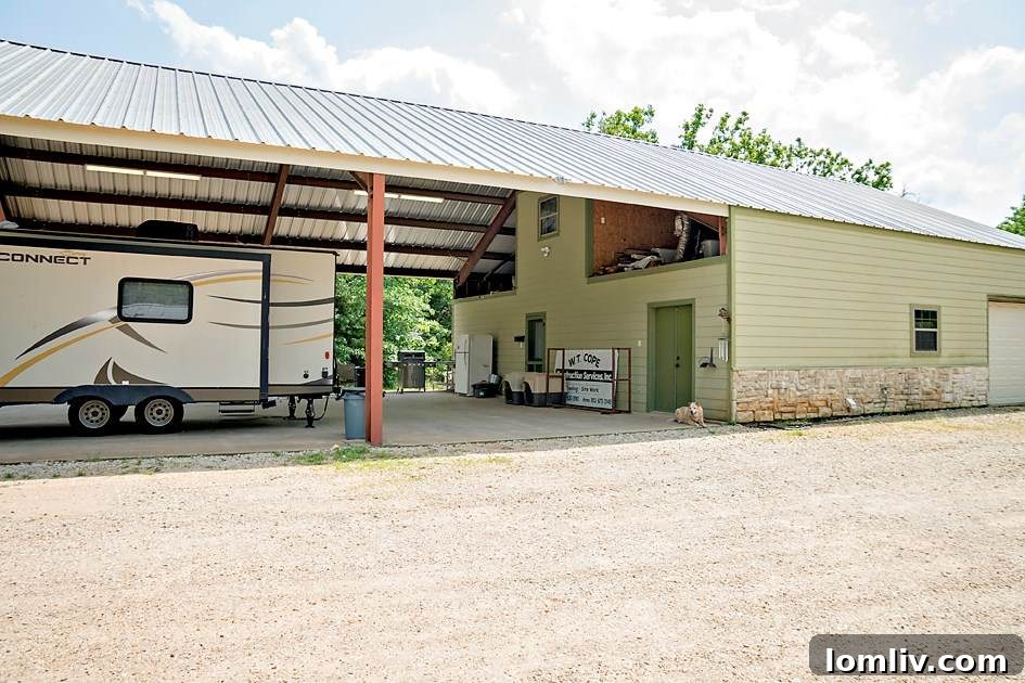 Modern kitchen with granite countertops and ample storage in the barndominium