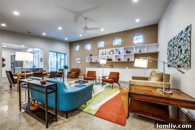 Modern interior design with polished concrete floors and Mid-Century Modern furniture