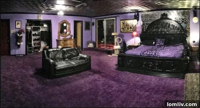 The opulent primary suite, affectionately named the 'Crown Royal Suite' by Bob Moseley, showcasing the home's distinctive Goth-inspired decor with dark hues, rich textures, and unique accents.
