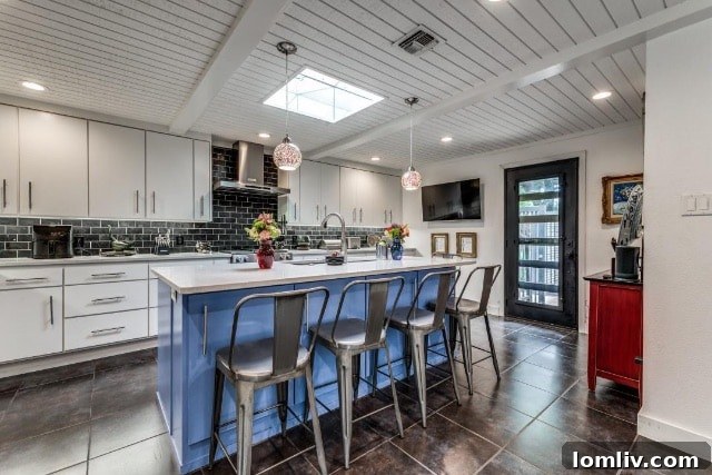Elegant dining space adjacent to the chef's kitchen in the Ridglea residence