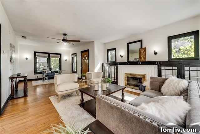 Interior Living Room of Oakhurst Tudor Home Featuring Craftsman Fireplace and Built-in Bookcases