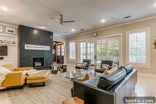 The grand entry of 2516 Sandage Avenue is flooded with natural light, showcasing handsome oak-paneled doors and elegant whitewashed oak floors.