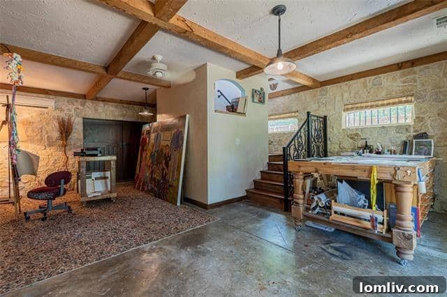 The ultimate home office solution: 7130 Brookcove offers multiple flexible spaces, including a two-story artist's studio, perfect for remote work.