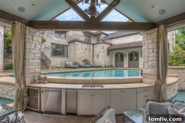 Luxury Pool with Balcony View and Swim-Up Bar