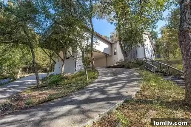 Architectural detail of the split-level home at 816 Shadyridge Drive, highlighting its multi-level design and lush surroundings