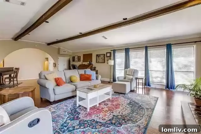 Expansive sliding glass doors and floor-to-ceiling windows in the living room, offering abundant natural light and scenic views