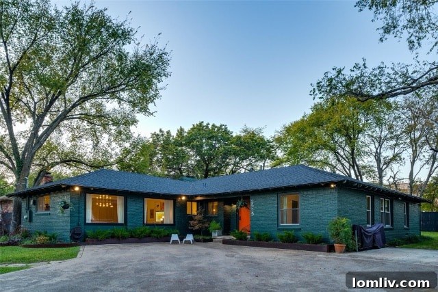 Stylish Kiestwood home entry with modern light fixture and blonde wood floors