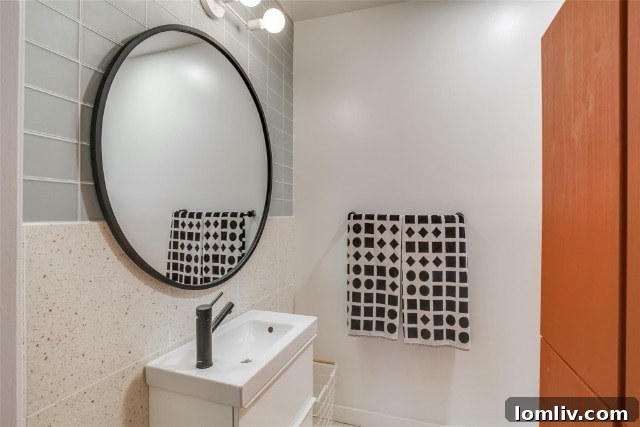 Elegant Kiestwood master bathroom with modern vanity and large mirror