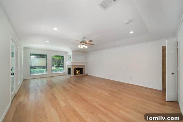 Primary bedroom with fireplace overlooking the pool