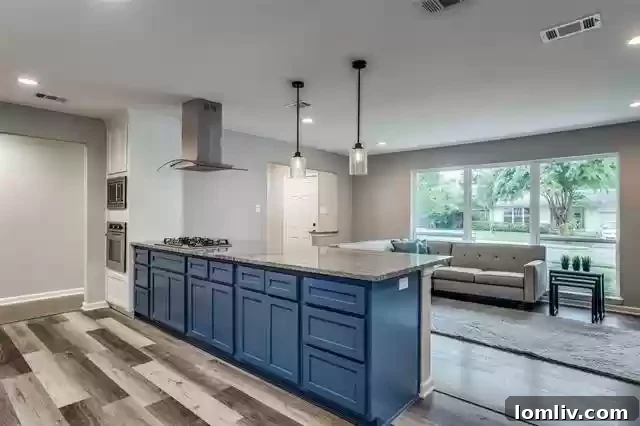 Staged living room of 2633 Materhorn Drive with a fireplace and ample natural light.