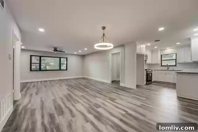 Another view of the spacious living area, showing open concept design.