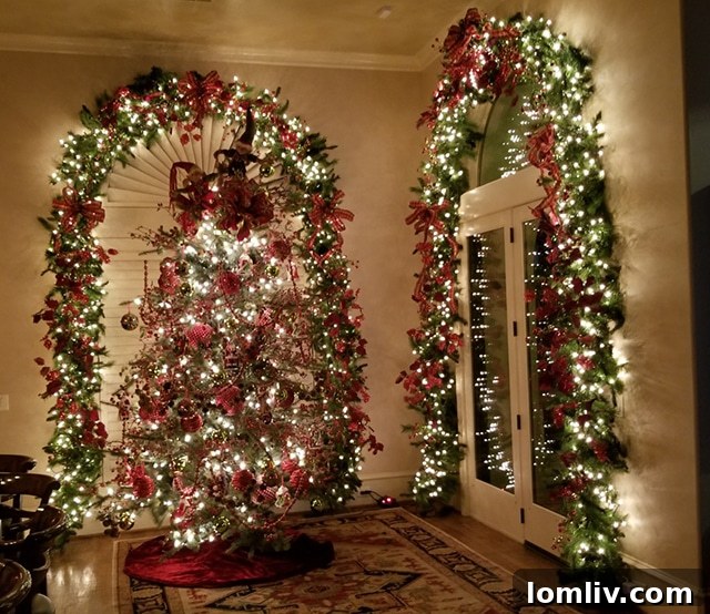 A beautifully decorated front door with Christmas wreaths, garlands, and lights, a signature style of Charles Gregory's holiday designs.