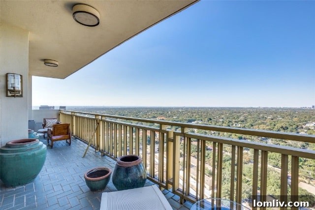 Spacious balcony with panoramic Dallas views from Preston Tower condo
