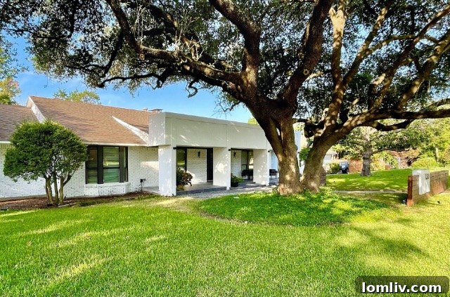 Front exterior of a North Dallas contemporary home with privacy fences