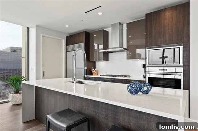 Luxurious gourmet kitchen with island and bar seating in Windrose Tower