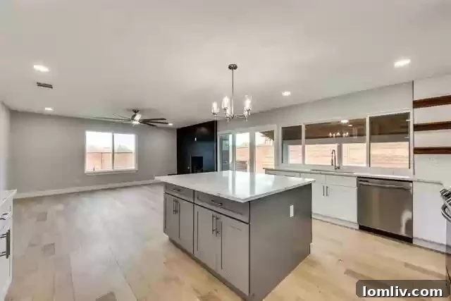 Modern kitchen with quartz countertops and Samsung appliances at 8503 Baumgarten Dr.