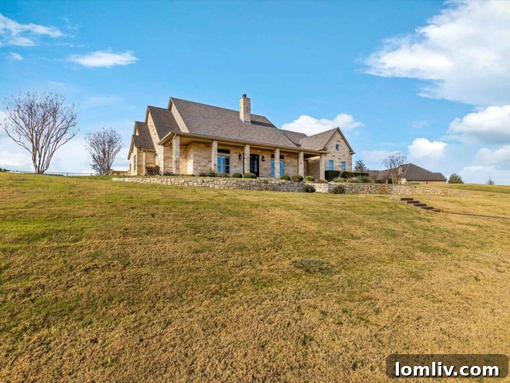 Luxury Benbrook home exterior with native Texas stone, Bella Flora