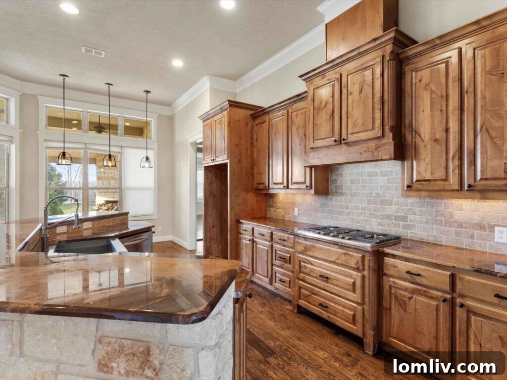 Elegant dining area overlooking the scenic acreage with large glass doors and transom windows