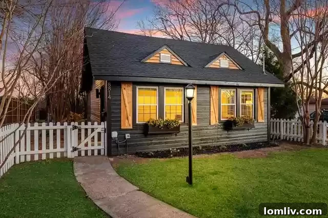 High-Contrast Cottage Adds Funk to Little Forest Hills 3 Striking Black Exterior and White Picket Fence