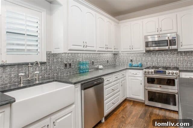 Kitchen view with stainless steel appliances and dual oven stove