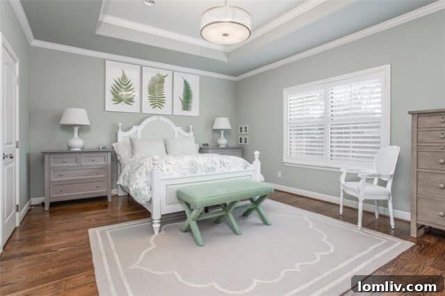 Restful master bedroom with oyster walls and tray ceiling