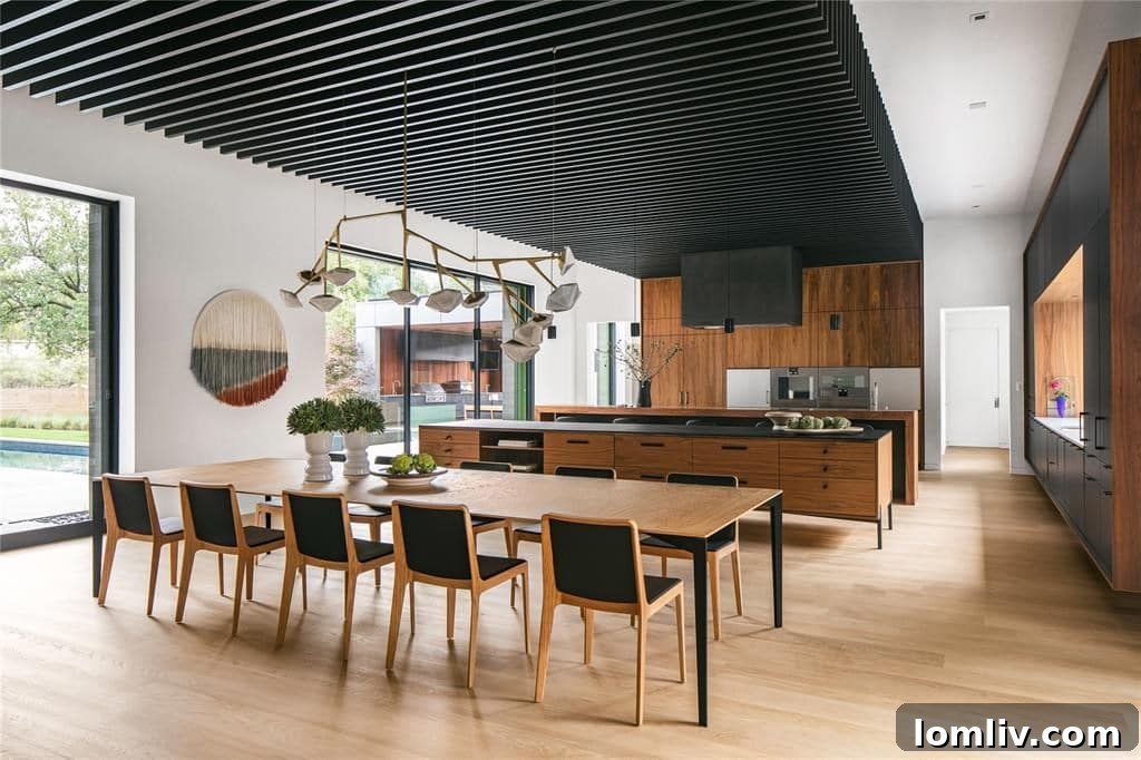 Elegant dining area adjacent to the kitchen in Taula House, designed for family gatherings