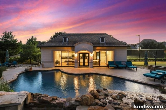 Resort-Style Pool with Waterslide and Spa Grotto