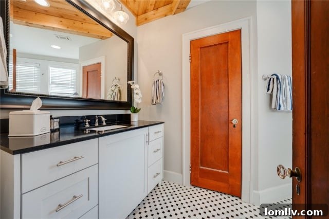 Luxurious master bathroom with chic fixtures, dual vanities, and sophisticated design elements for a spa-like experience.