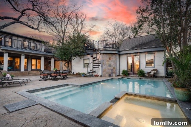Spacious bedroom filled with natural light, showcasing a harmonious blend of vintage charm and modern decor in the M Streets home.