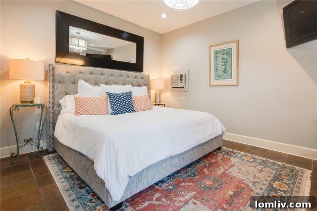 Beautifully staged bedroom with designer touches, abundant natural light, and inviting ambiance.