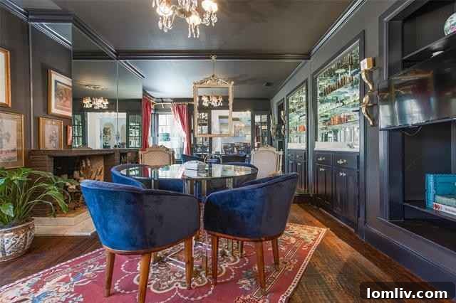 Monochrome mirrored game room with Louis XVI style fauteuil