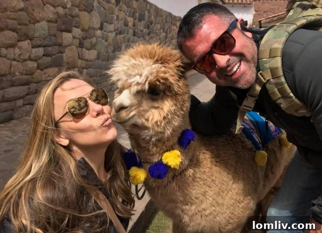 Corey Young and her husband Russ with an alpaca friend, enjoying an outdoor moment