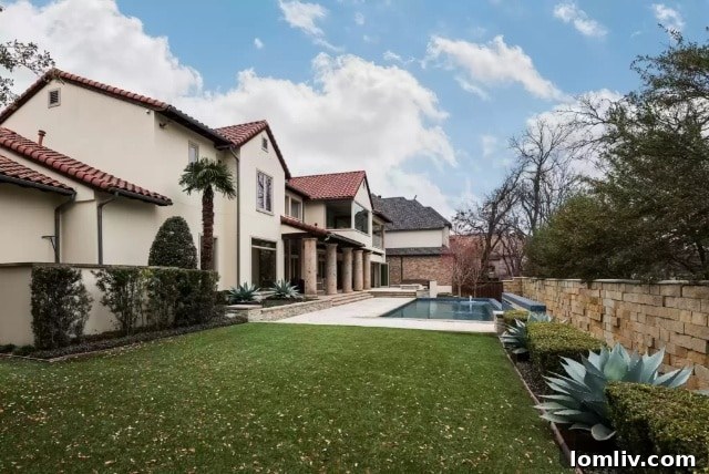 Lake Forest's Singular Gem: Rising Above Zero Lot Line Living 3 Luxurious 50-foot Swimming Pool and Outdoor Kitchen at 7107 Lake Edge Drive