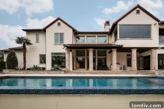 Lake Forest's Singular Gem: Rising Above Zero Lot Line Living 4 Expansive Patio and Cabana with Fold-Back Doors at Lake Forest Home
