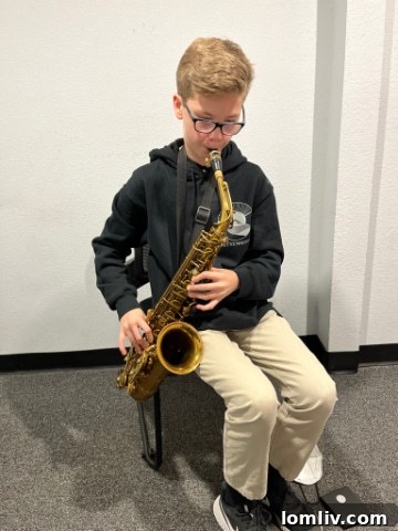 Bart Thrasher's son, Hank, playing guitar, following his dad's musical footsteps