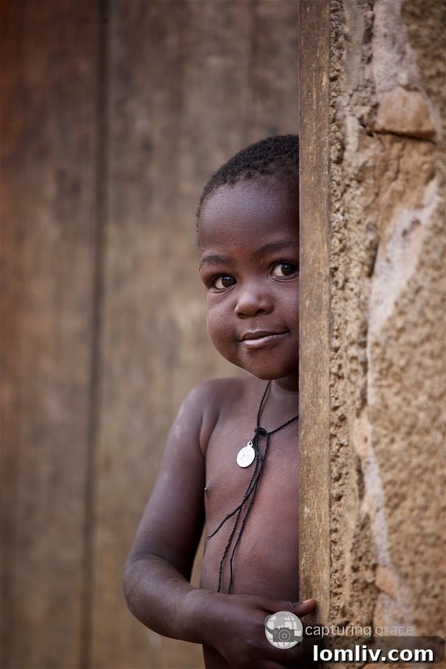 Smiling children photographed by Ronnie Mosley for Capturing Grace