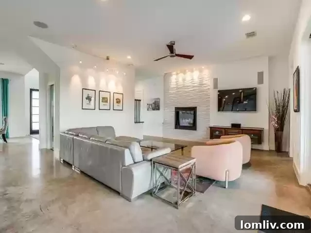 Spacious open-concept living room with modern fireplace