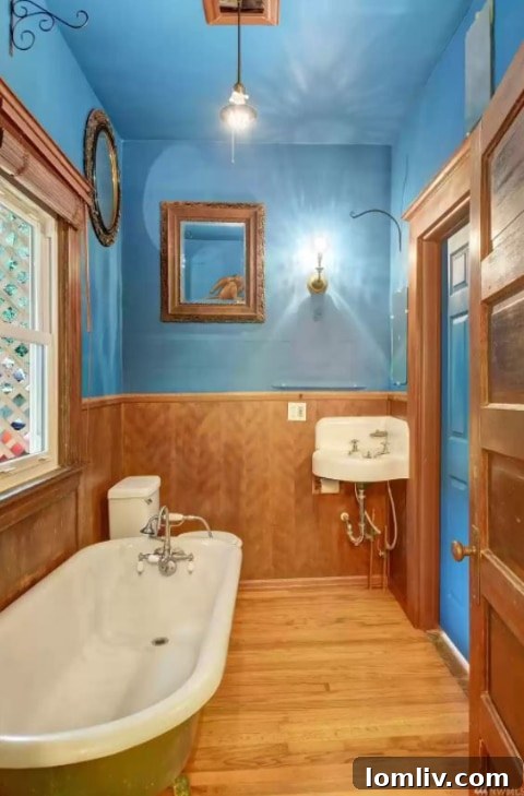Detail of a bathroom mirror, showing artistic flair and unconventional height