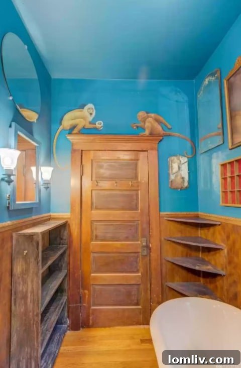 Close-up of a whimsical bathroom mural depicting mischievous monkeys