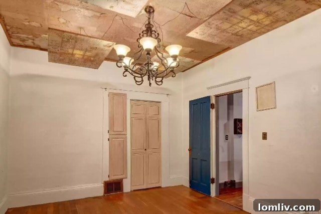Unique lighting fixture and raised platform in a room, offering a playful, multi-level space