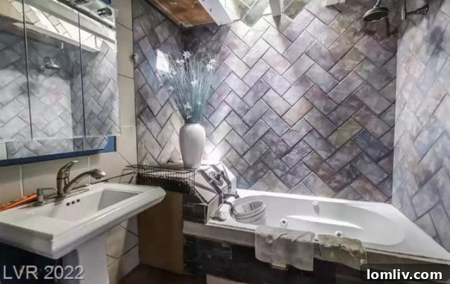 Bathroom Sink with Filthy Washcloths and Buckets