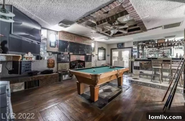 Eccentric Game Room with Mixed Materials on Ceiling
