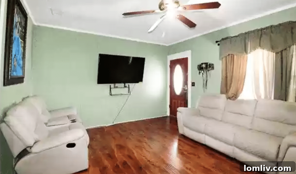 Inviting living area featuring a dry bar and a comforting wood-burning fireplace.