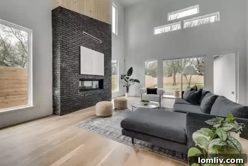 A grand entrance with high ceilings and sophisticated design elements in a new Dallas home.