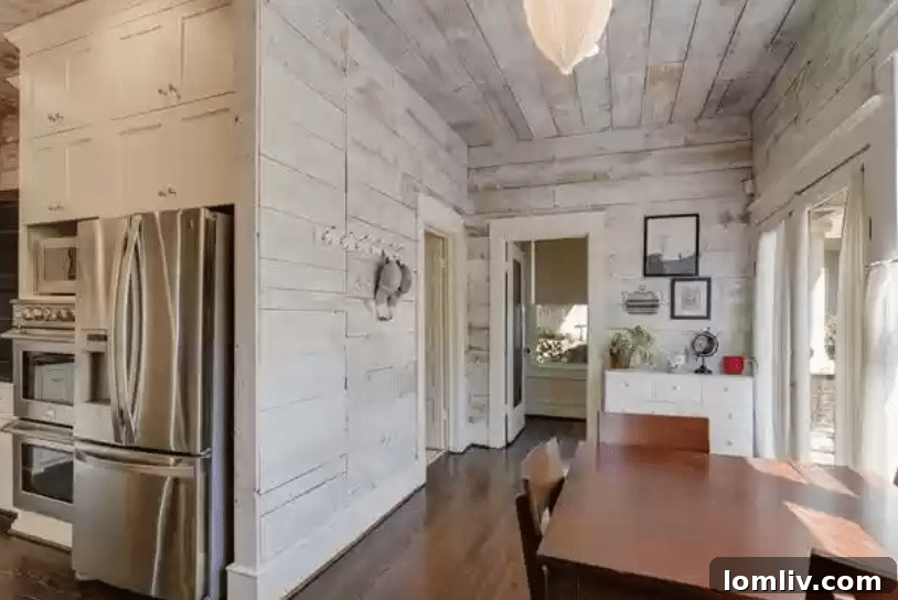 Interior view showcasing original hardwood floors, intricate millwork, and classic architectural details.