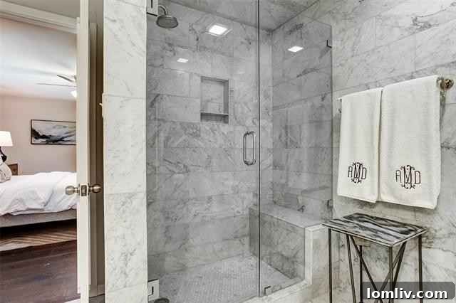 Spa-Quality Marble Shower Stall with Integrated Bench in Master Bath