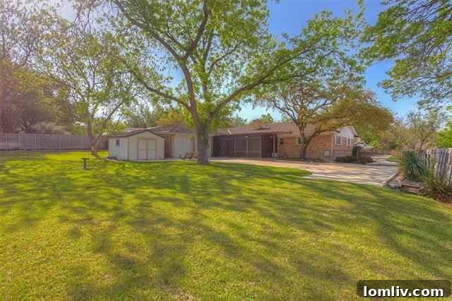 Spacious Backyard of a Renovated Ranch Home with Mature Trees