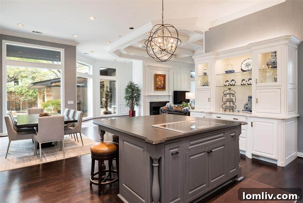 The state-of-the-art kitchen island at 6049 Glendora, equipped with a beautiful induction cooktop and ample counter space, ideal for gourmet cooking.