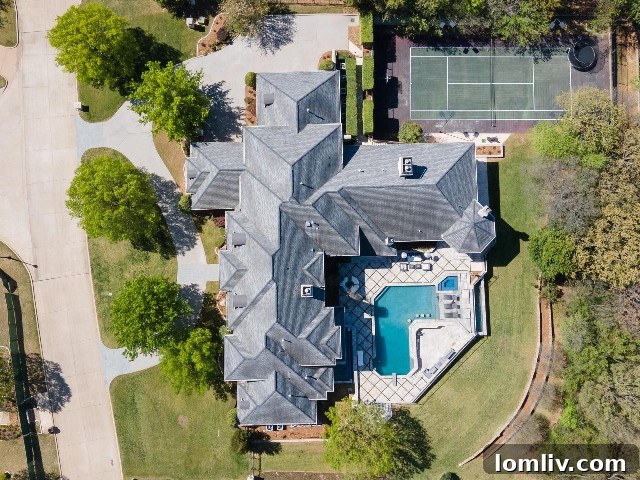 Aerial view of luxury backyard with pool, tennis court