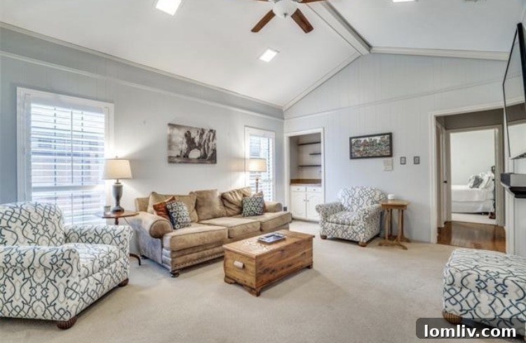 Well-appointed kitchen with granite countertops and double ovens in a family home.
